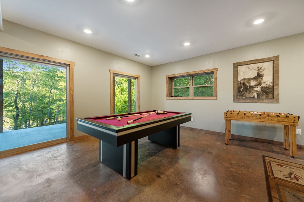 44 Lower Toccoa Hills Road Blue Ridge, GA 30513 - Photo 23 of 36 a room with furniture pool table flat screen tv and windows