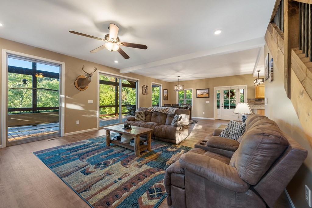 44 Lower Toccoa Hills Road Blue Ridge, GA 30513 - Photo 7 of 36 a living room with furniture and a large window