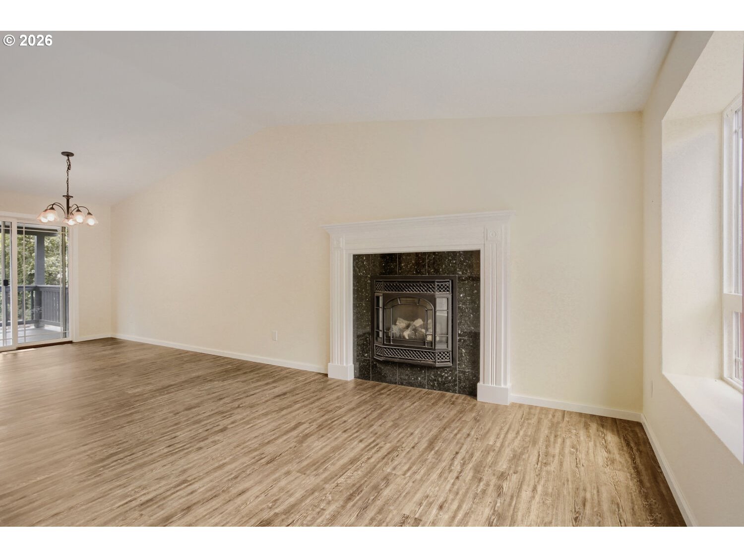 14539 Southeast Center Street Portland, OR 97236 - Photo 7 of 30 a view of an empty room and window