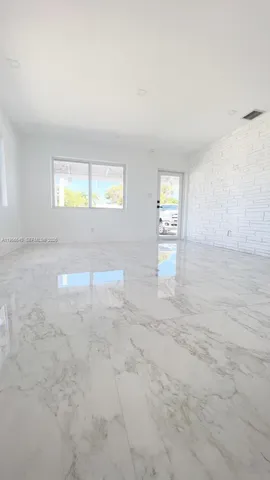 a view of empty room with windows