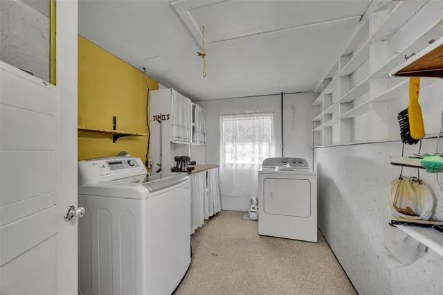 a kitchen with sink a stove and refrigerator