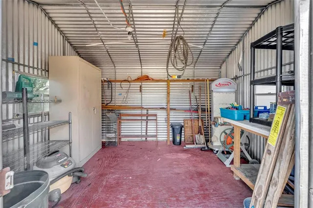 a view of an empty room with a staircase