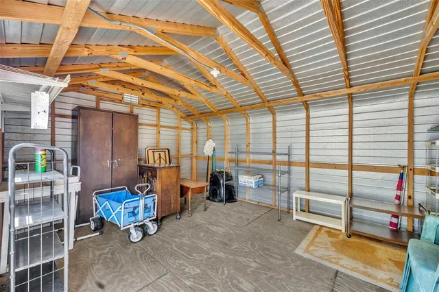 a building outdoor space with patio furniture and potted plants