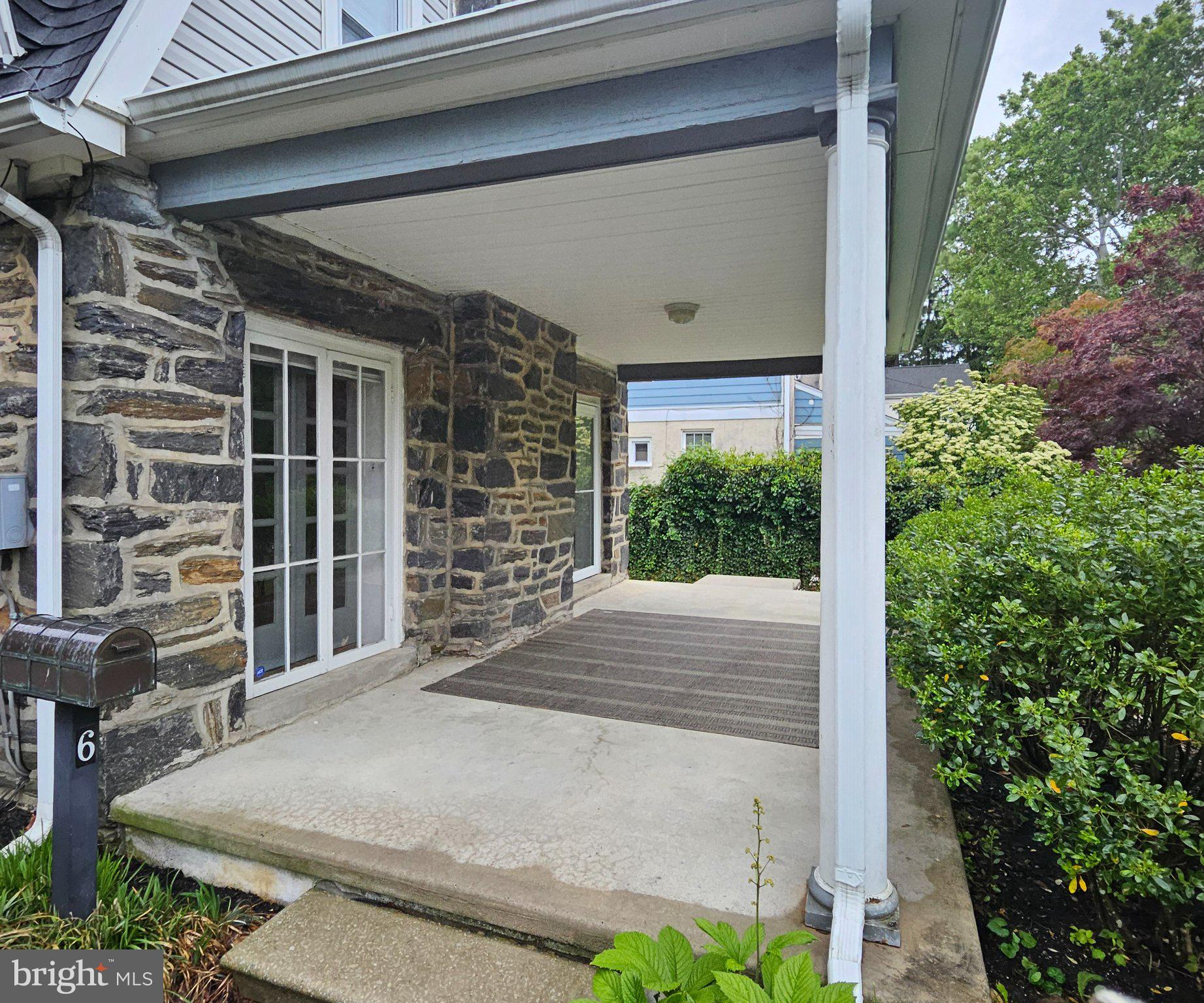 6 Arthur Road, Unit FRONT Rosemont, PA 19010 - Photo 24 of 24 Charming stone entryway with greenery.