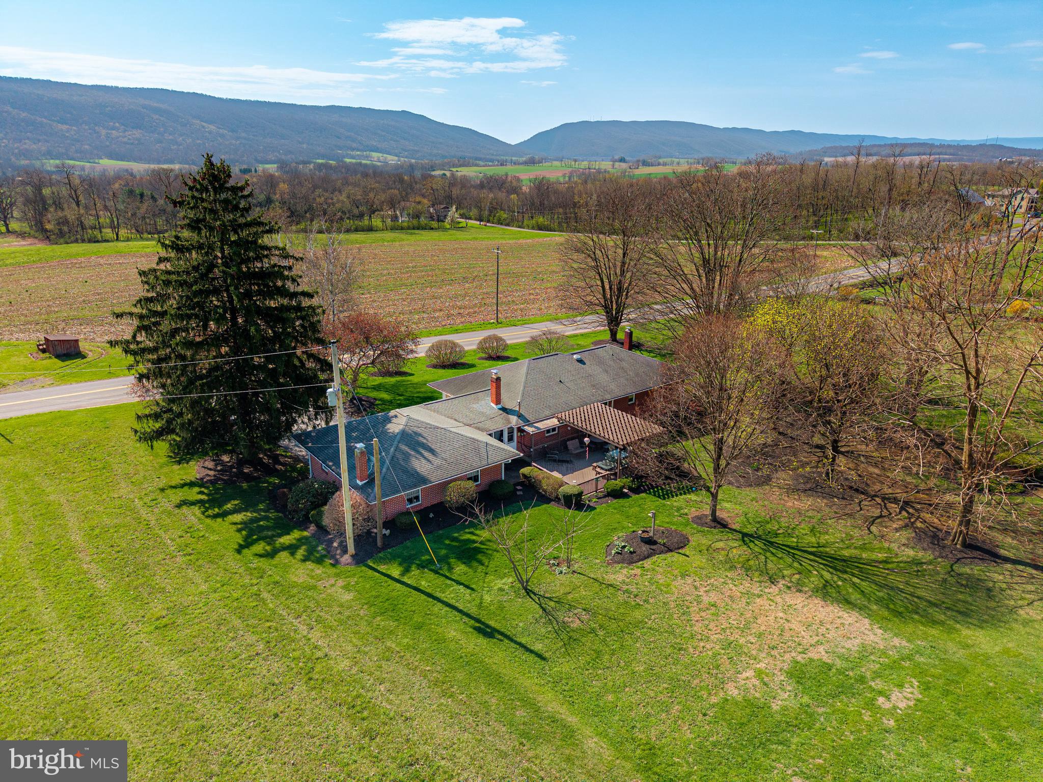 1771 Upper Snake Spring Road Everett, PA 15537 - Photo 54 of 62 a view of a lake with a mountain in the background