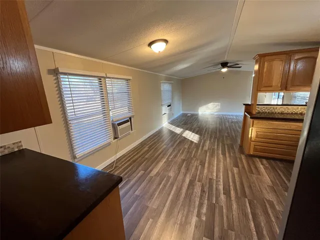 a view of a living room hardwood and kitchen