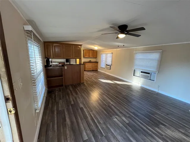 a view of a backyard with wooden fence