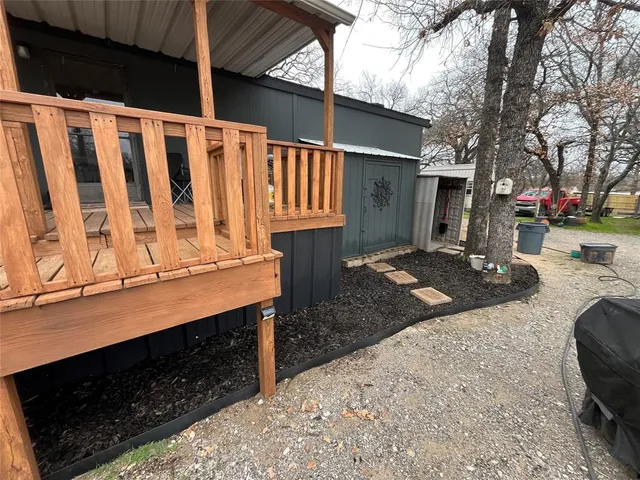 a view of backyard with parked car