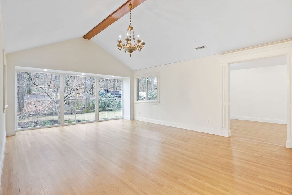 80 Doublet Hill Road Weston, MA 02493 - Photo 19 of 38 a view of an empty room with wooden floor and a window