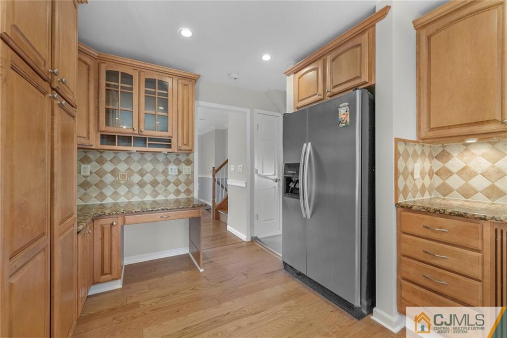 33 Hazel Avenue Edison, NJ 08820 - Photo 11 of 52 a kitchen with stainless steel appliances granite countertop a refrigerator and a sink