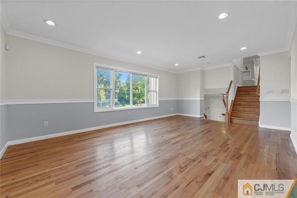33 Hazel Avenue Edison, NJ 08820 - Photo 17 of 52 an empty room with wooden floor and windows