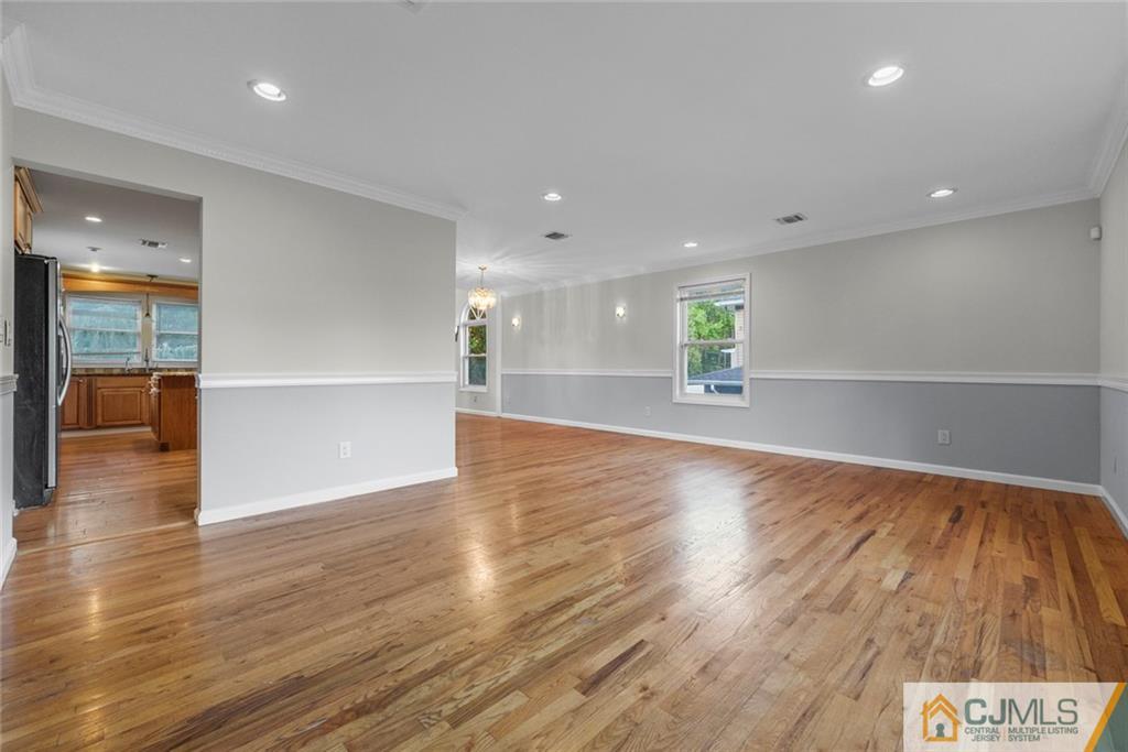 33 Hazel Avenue Edison, NJ 08820 - Photo 18 of 52 a view of an empty room with wooden floor