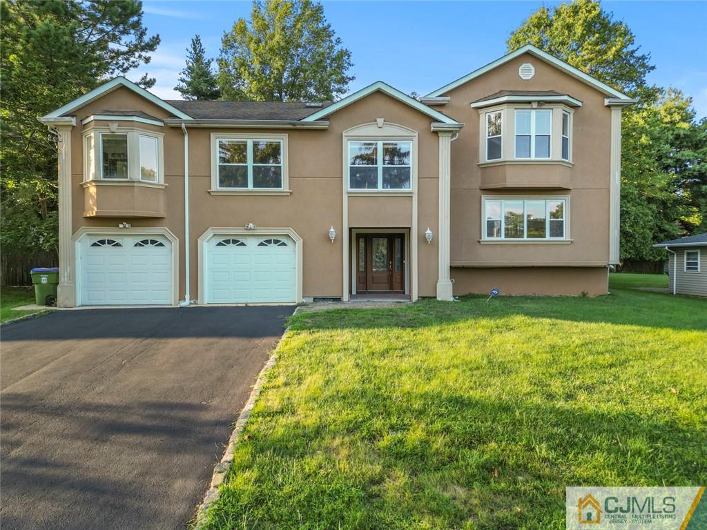 33 Hazel Avenue Edison, NJ 08820 - Photo 2 of 52 a front view of a house with garden
