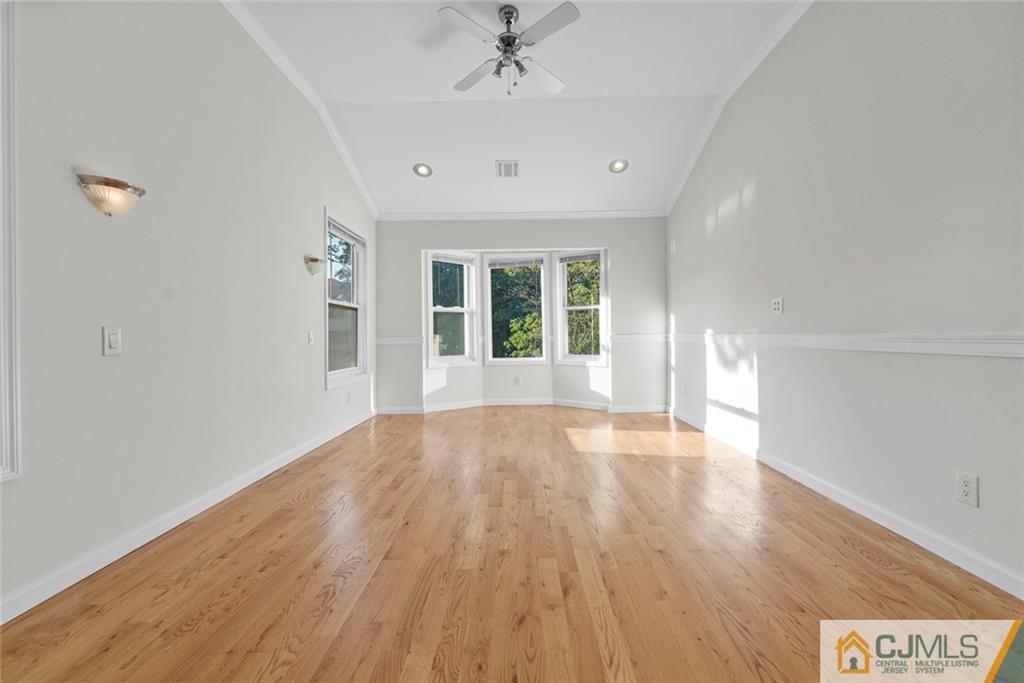 33 Hazel Avenue Edison, NJ 08820 - Photo 24 of 52 wooden floor in an empty room with a window