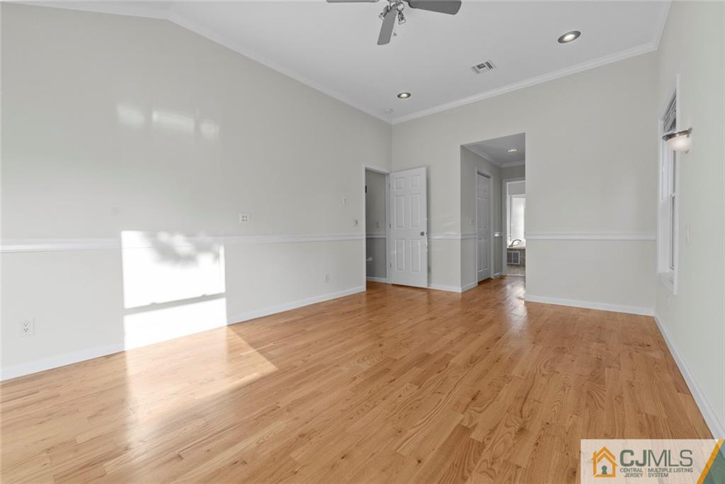 33 Hazel Avenue Edison, NJ 08820 - Photo 26 of 52 a view of an empty room and wooden floor