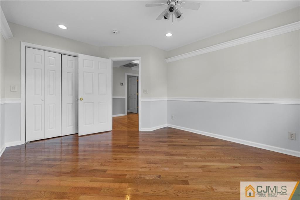 33 Hazel Avenue Edison, NJ 08820 - Photo 38 of 52 a view of an empty room with wooden floor