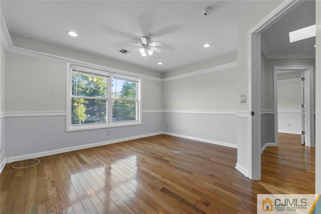 33 Hazel Avenue Edison, NJ 08820 - Photo 39 of 52 wooden floor in an empty room with a window