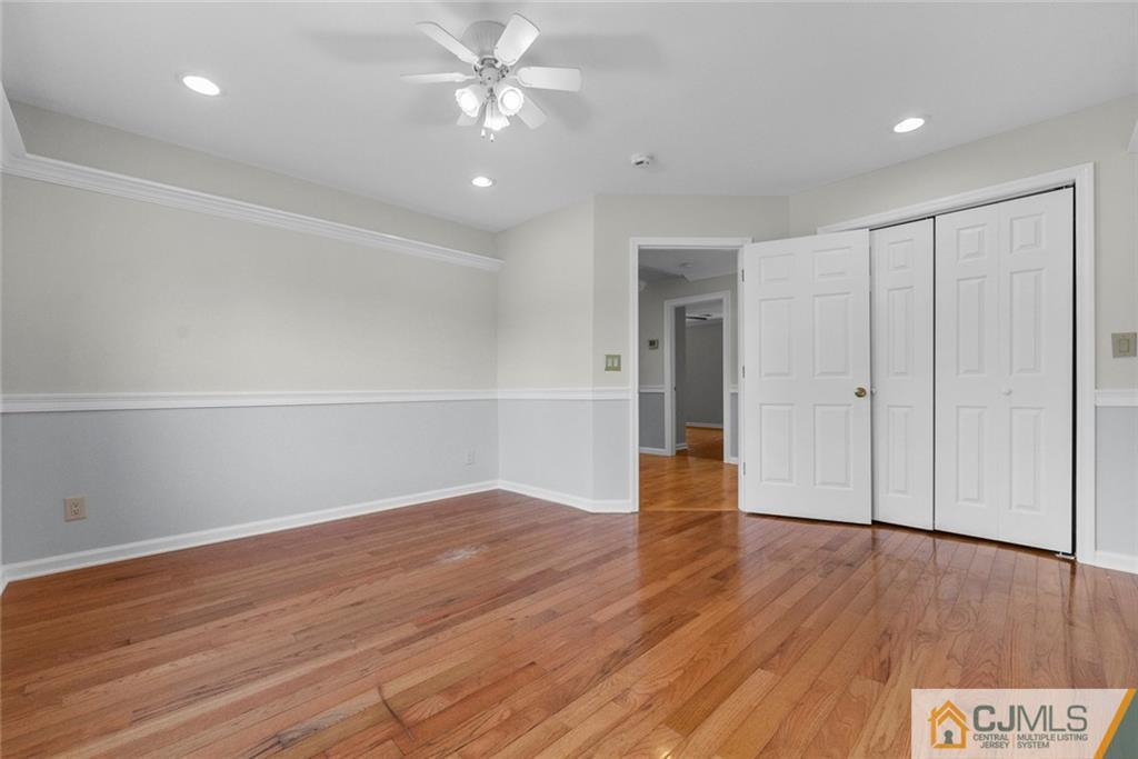 33 Hazel Avenue Edison, NJ 08820 - Photo 40 of 52 a view of an empty room with wooden floor