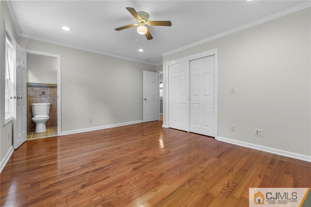 33 Hazel Avenue Edison, NJ 08820 - Photo 41 of 52 wooden floor in an empty room with a window