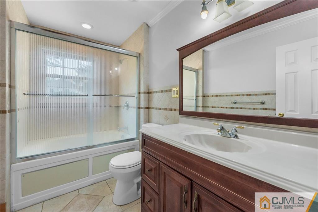 33 Hazel Avenue Edison, NJ 08820 - Photo 45 of 52 a bathroom with a sink a toilet and shower