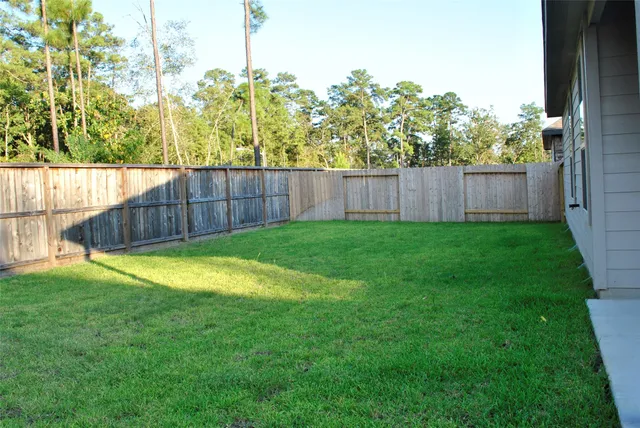 a view of a back yard of the house
