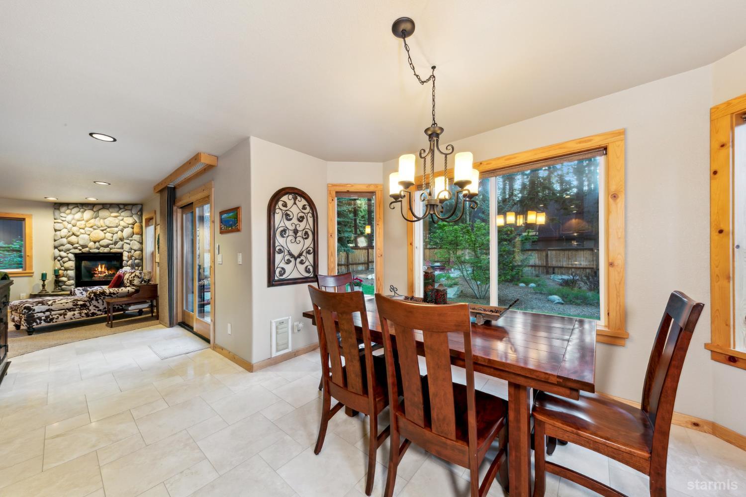 817 Kiowa Drive South Lake Tahoe, CA 96150 - Photo 13 of 39 a view of a dining room with furniture window and outside view