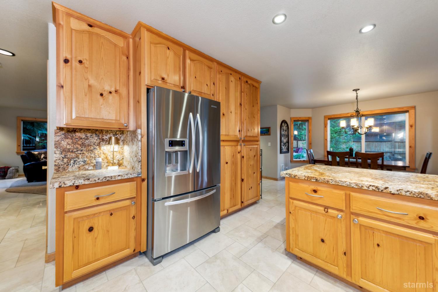 817 Kiowa Drive South Lake Tahoe, CA 96150 - Photo 18 of 39 a kitchen with granite countertop cabinets stainless steel appliances and a counter space