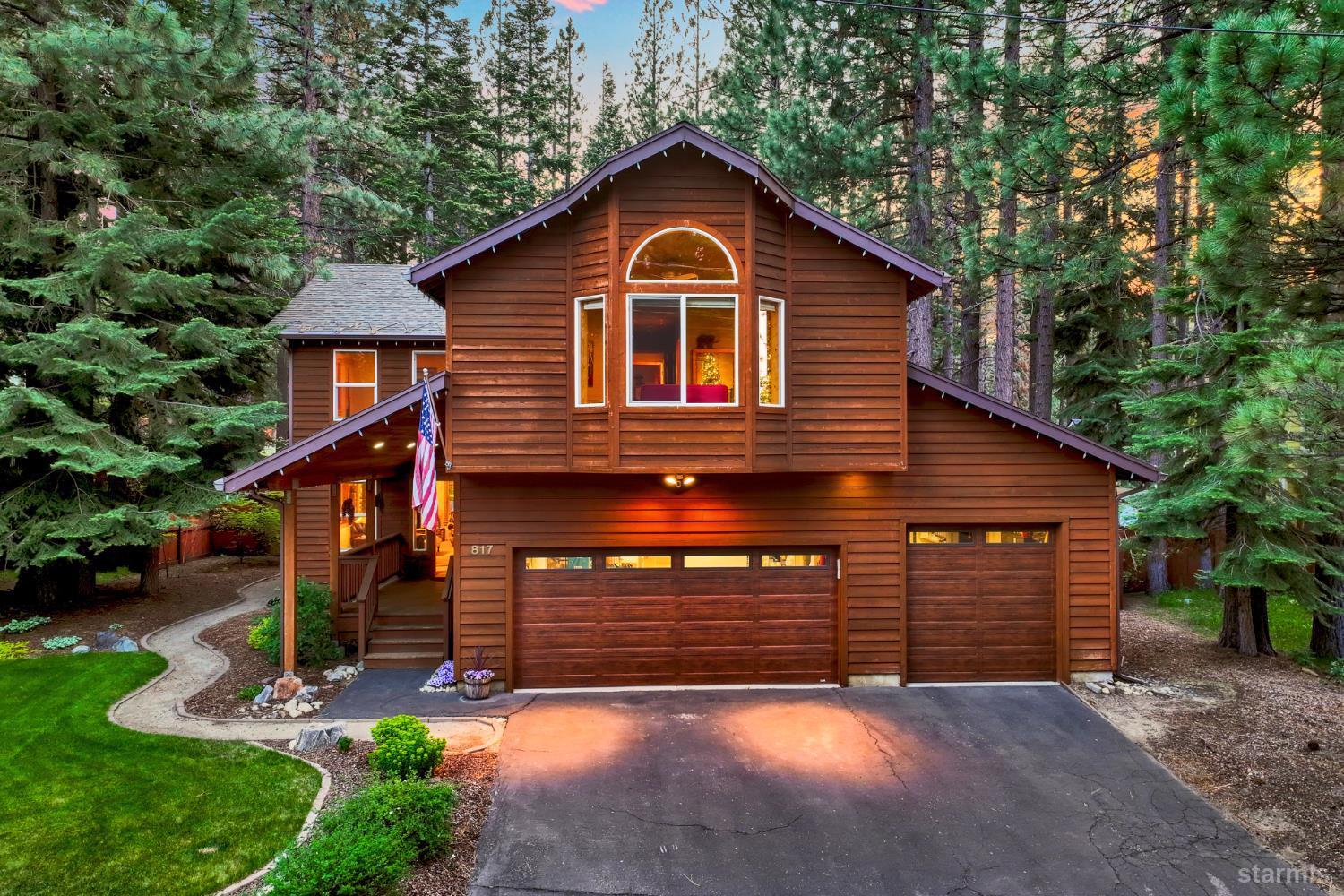 817 Kiowa Drive South Lake Tahoe, CA 96150 - Photo 2 of 39 a front view of a house with a yard