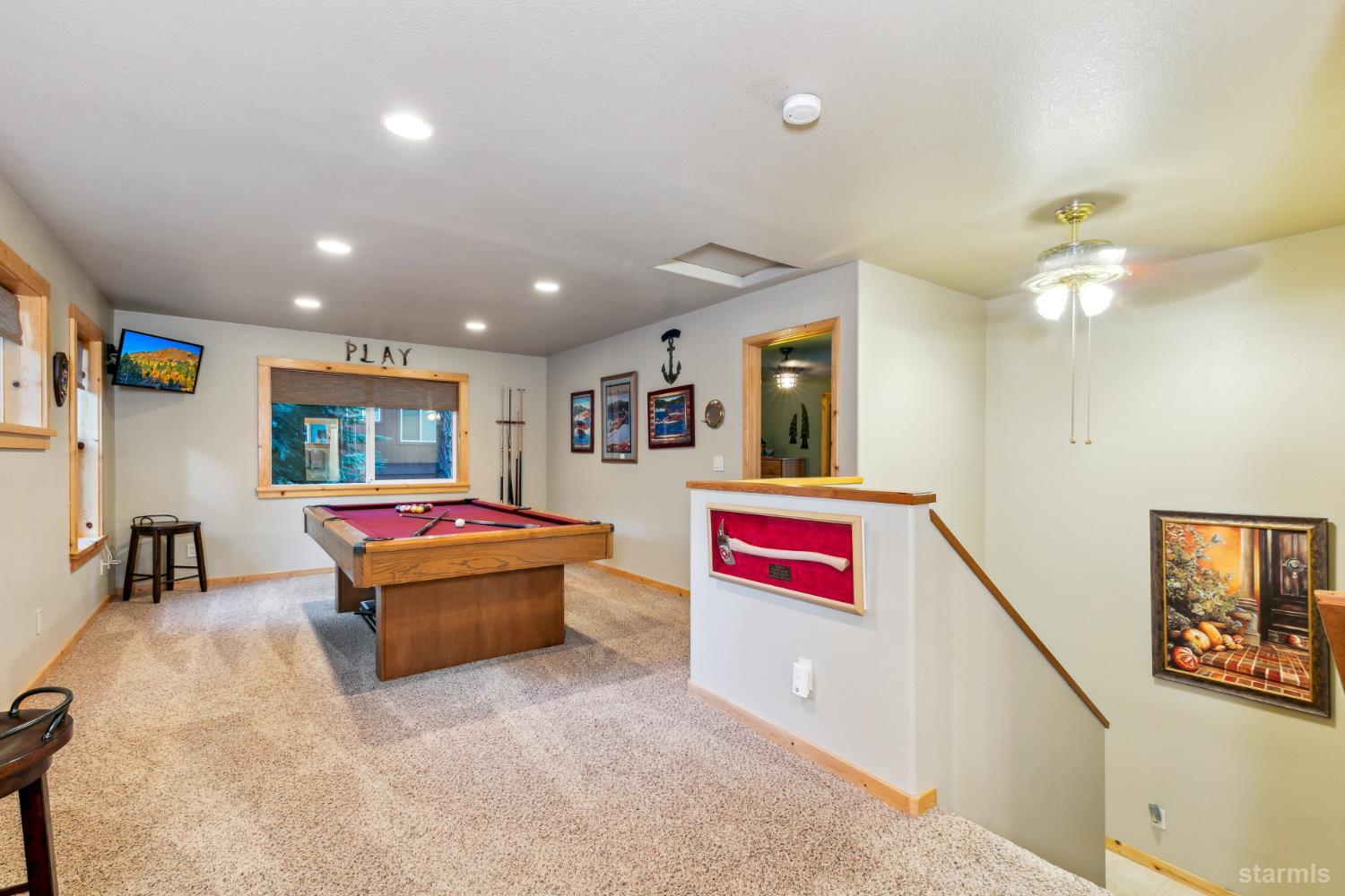 817 Kiowa Drive South Lake Tahoe, CA 96150 - Photo 26 of 39 a living room with furniture and a flat screen tv