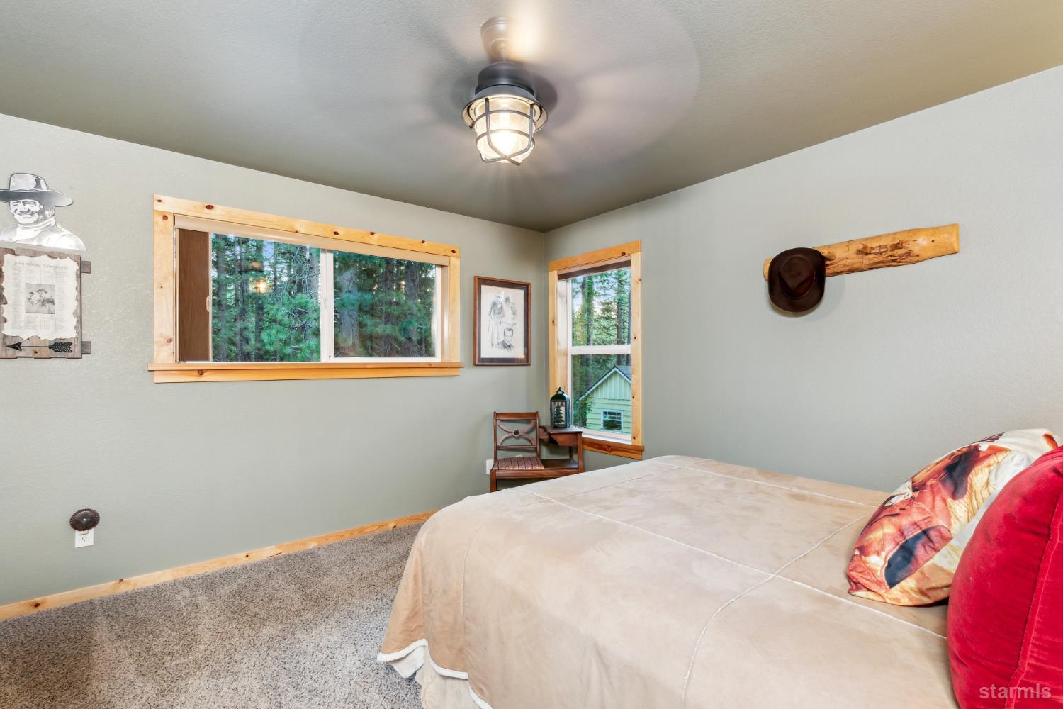 817 Kiowa Drive South Lake Tahoe, CA 96150 - Photo 30 of 39 a bedroom with a bed and a window