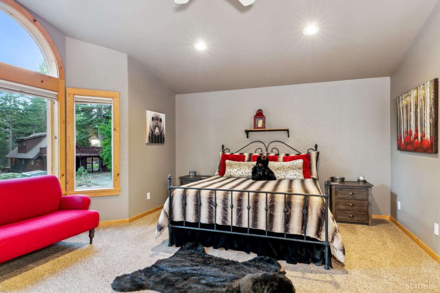 817 Kiowa Drive South Lake Tahoe, CA 96150 - Photo 34 of 39 a bedroom with a bed and a couch