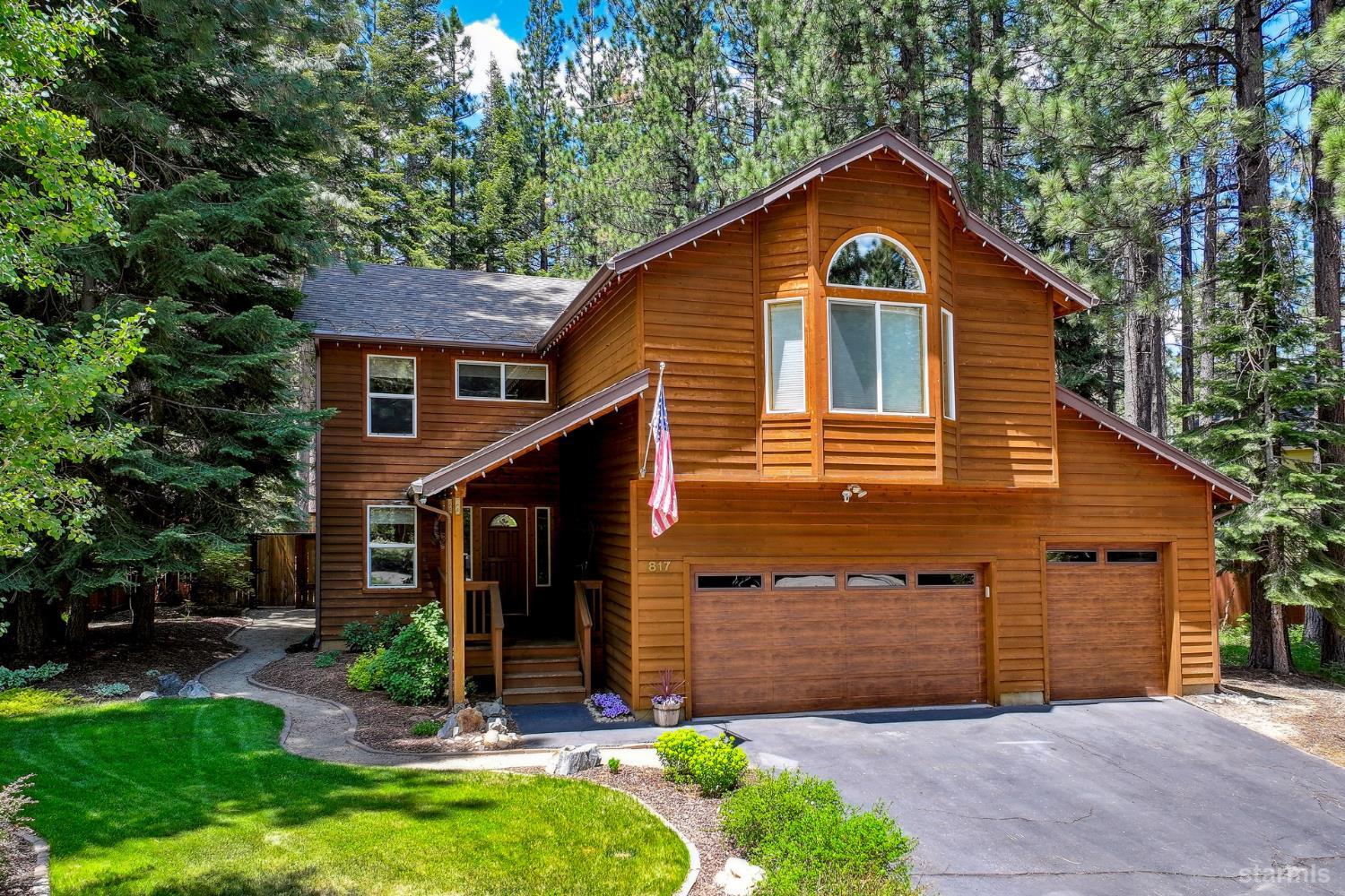 817 Kiowa Drive South Lake Tahoe, CA 96150 - Photo 39 of 39 a front view of a house with a yard and garage
