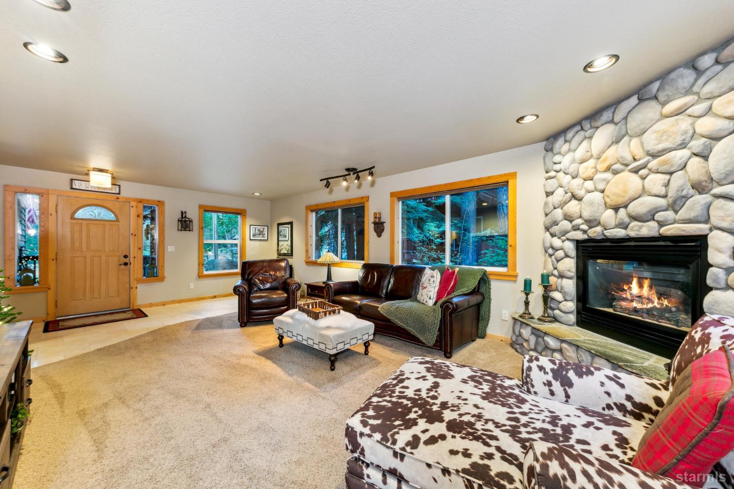 817 Kiowa Drive South Lake Tahoe, CA 96150 - Photo 10 of 39 a living room with furniture and a fireplace