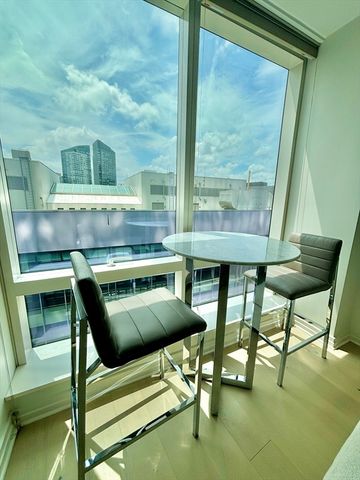 a kitchen with a table chairs and a stove
