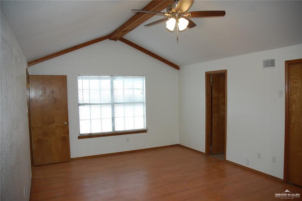 2401 South Jackson Road, Unit 26P Pharr, TX 78577 - Photo 12 of 15 an empty room with windows and fan
