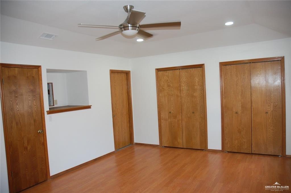 2401 South Jackson Road, Unit 26P Pharr, TX 78577 - Photo 6 of 15 a view of an empty room with wooden floor