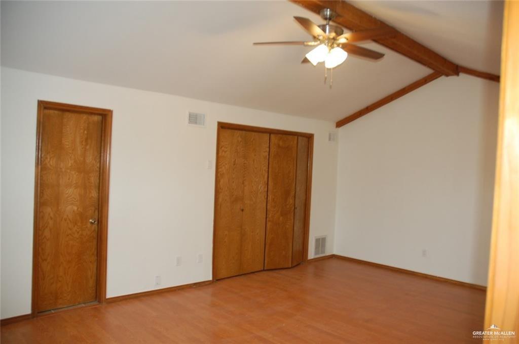 2401 South Jackson Road, Unit 26P Pharr, TX 78577 - Photo 10 of 15 a view of a room with a ceiling fan and a window