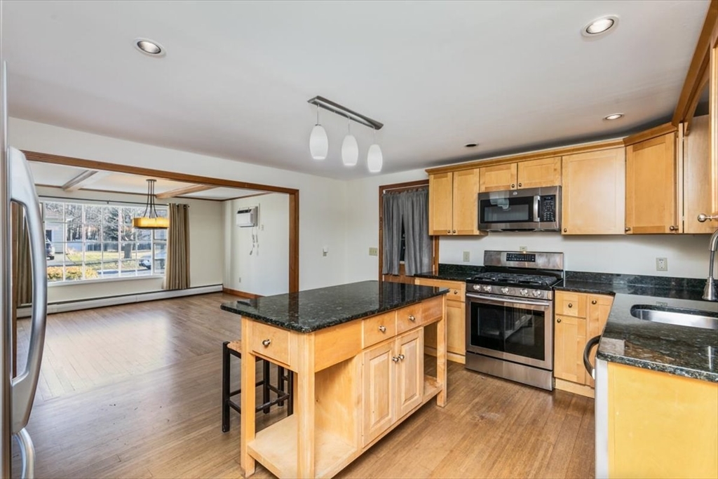 145 Warrenton Road Haverhill, MA 01832 - Photo 13 of 38 a kitchen with stainless steel appliances granite countertop a stove and a sink