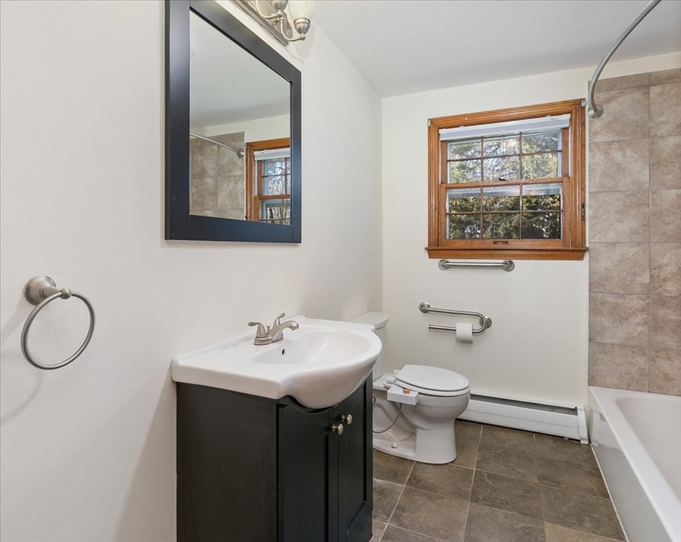 145 Warrenton Road Haverhill, MA 01832 - Photo 14 of 38 a bathroom with a toilet a sink and mirror