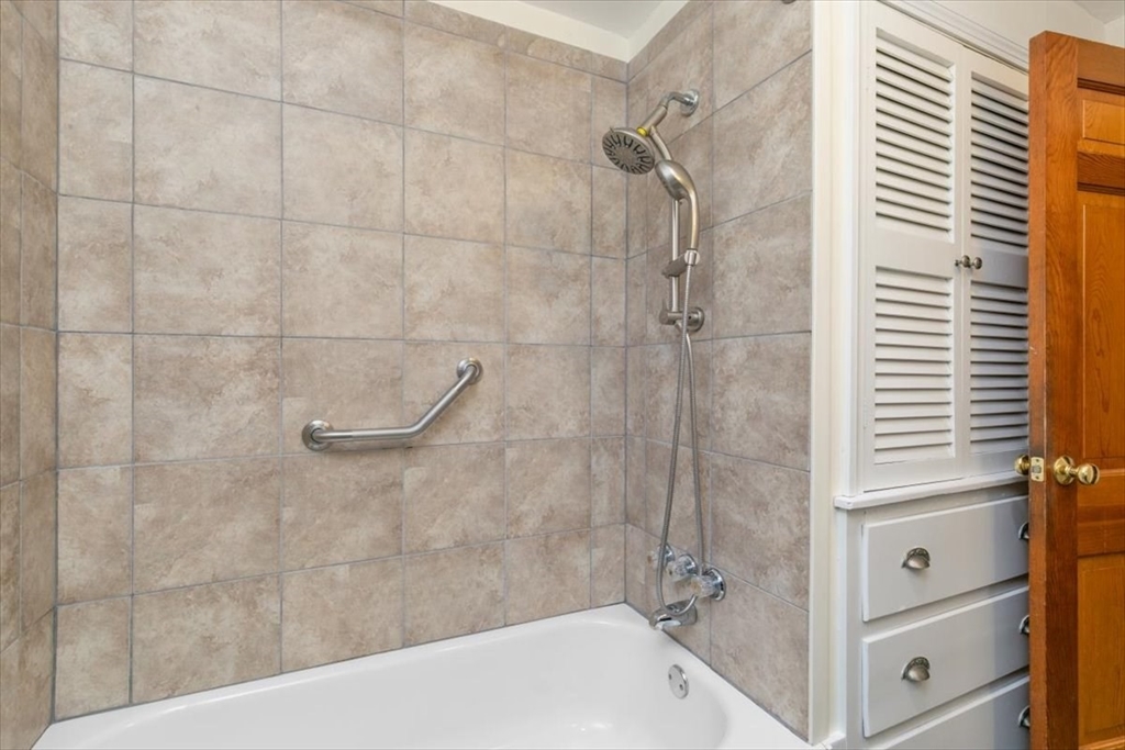 145 Warrenton Road Haverhill, MA 01832 - Photo 15 of 38 a bathroom with a bathtub and shower