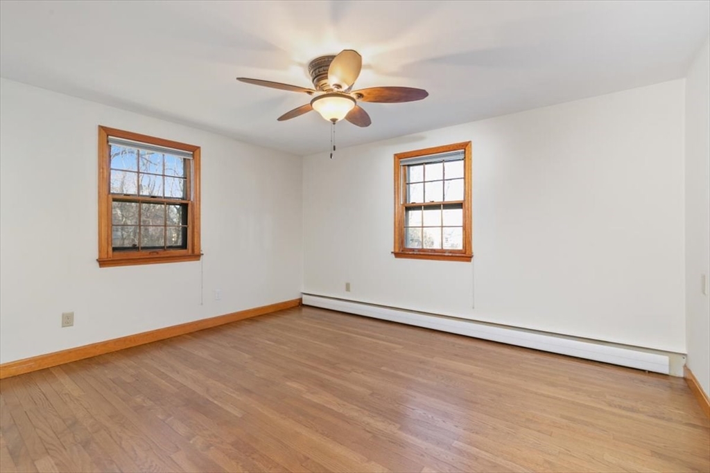 145 Warrenton Road Haverhill, MA 01832 - Photo 16 of 38 a view of an empty room with wooden floor and a window