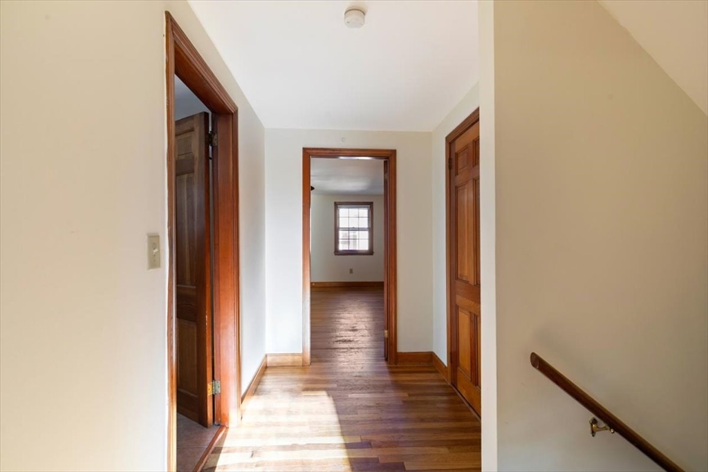 145 Warrenton Road Haverhill, MA 01832 - Photo 18 of 38 a view of a hallway with wooden floor