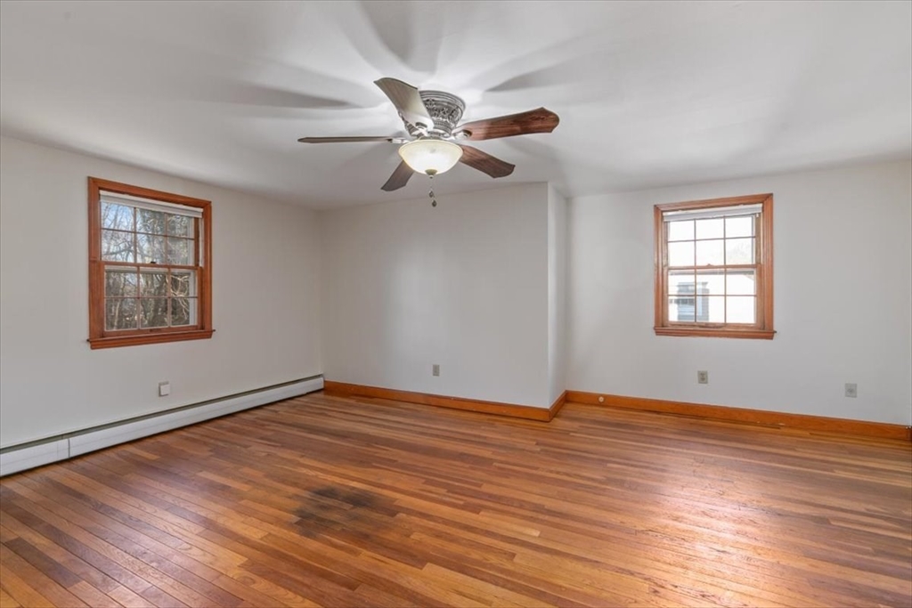 145 Warrenton Road Haverhill, MA 01832 - Photo 24 of 38 a view of an empty room with window and wooden floor