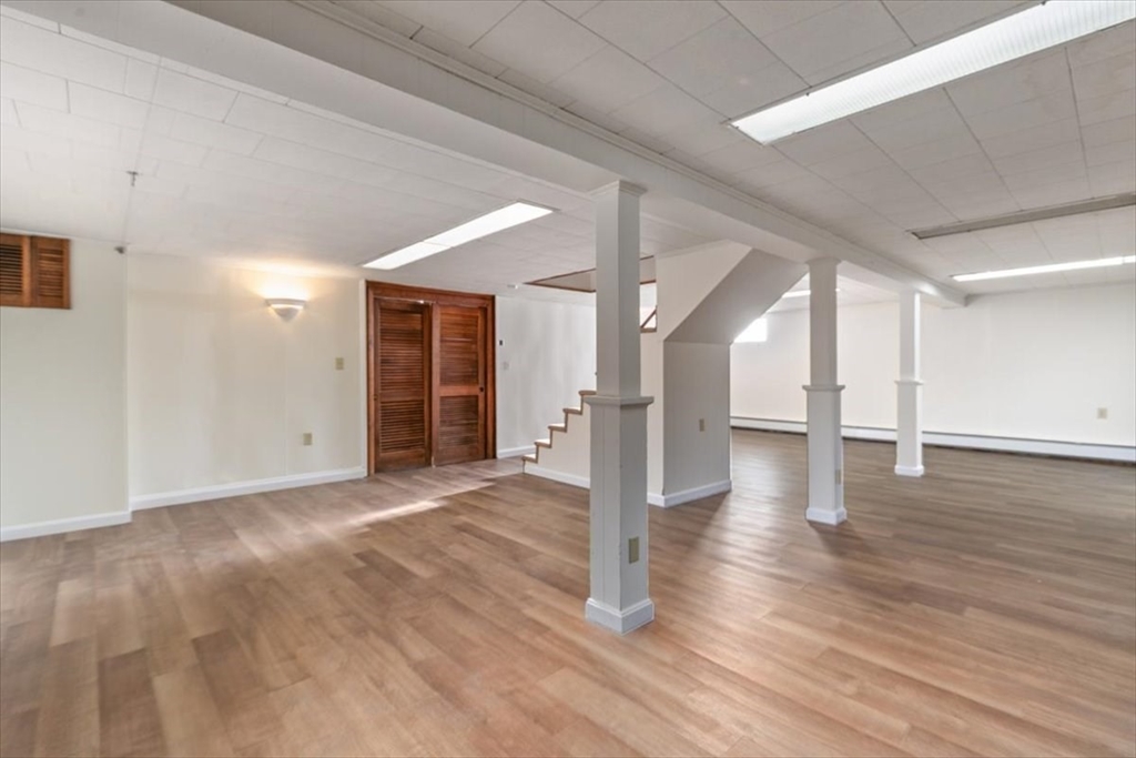 145 Warrenton Road Haverhill, MA 01832 - Photo 27 of 38 a view of a hallway with wooden floor