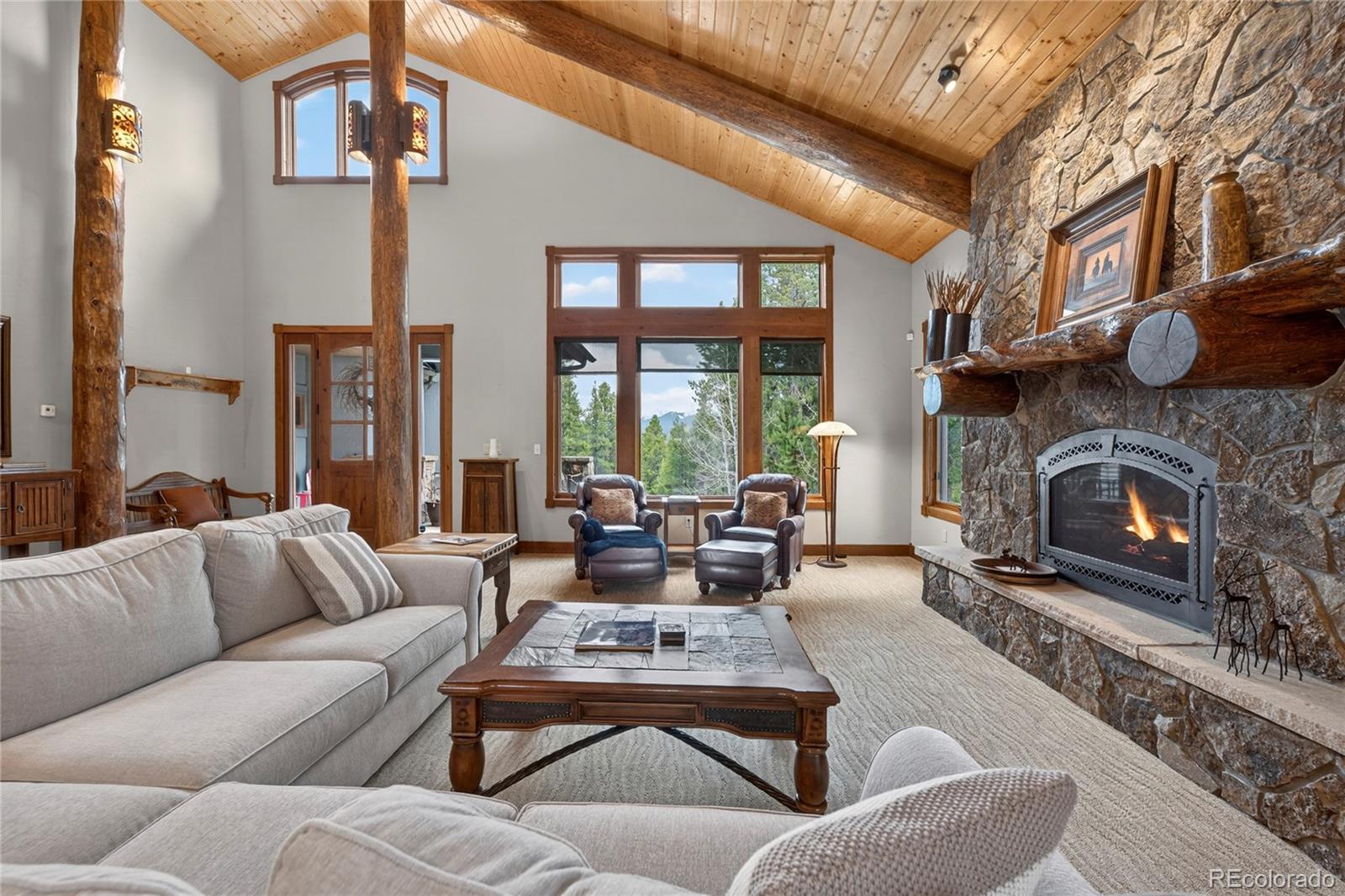 148 County Road Tabernash, CO 80478 - Photo 12 of 45 a living room with furniture fireplace and a large window