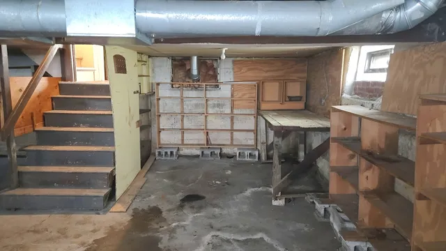 a view of staircase with a rug and a window