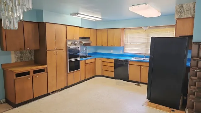 a kitchen with stainless steel appliances a refrigerator and a stove