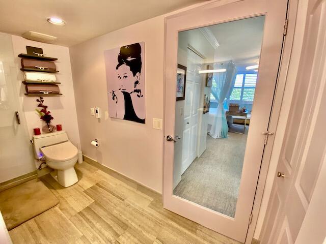 3594 South Ocean Boulevard, Unit 207 Highland Beach, FL 33487 - Photo 16 of 56 a bathroom with a sink and mirror