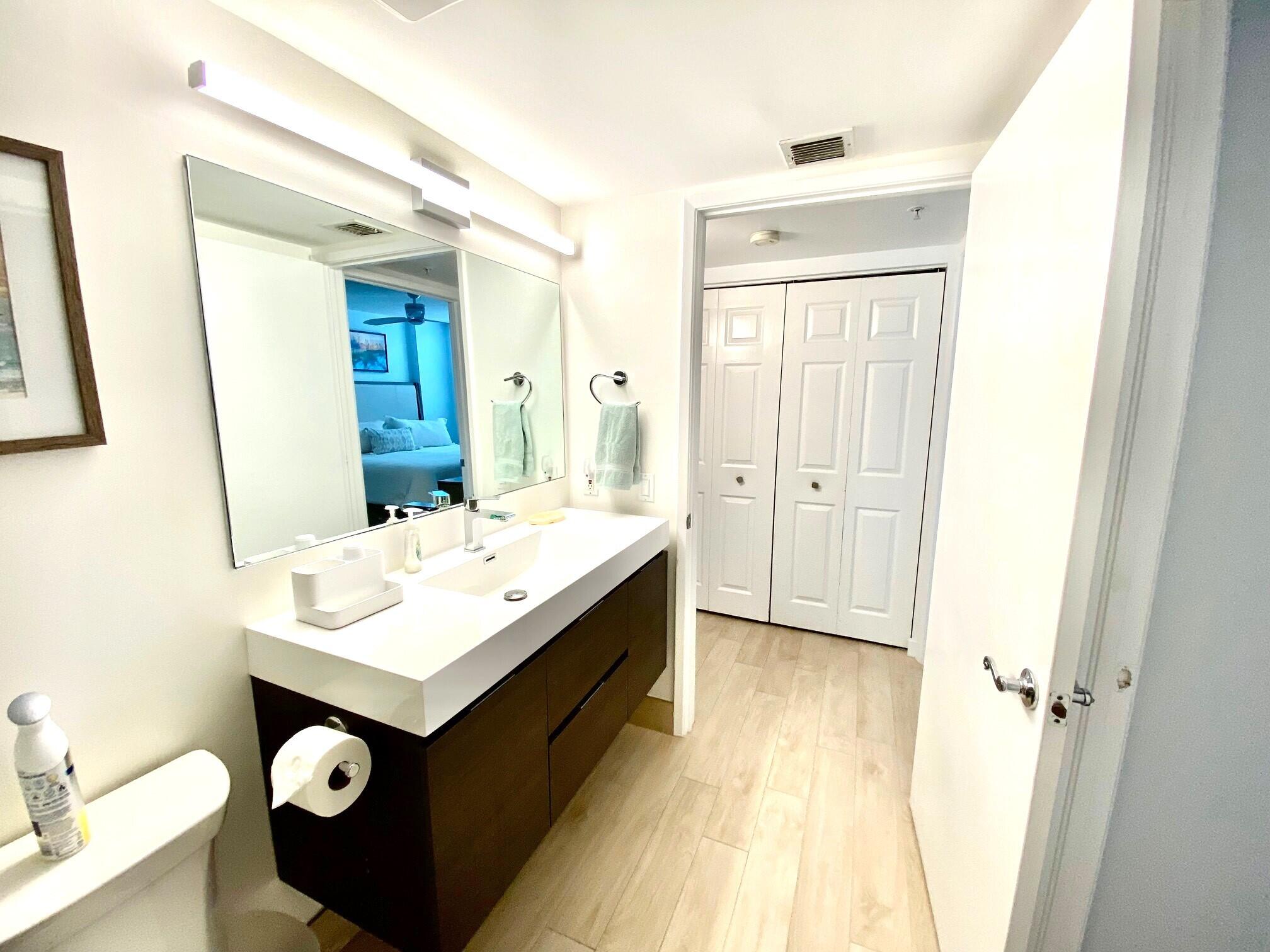 3594 South Ocean Boulevard, Unit 207 Highland Beach, FL 33487 - Photo 23 of 56 a bathroom with a sink and a mirror