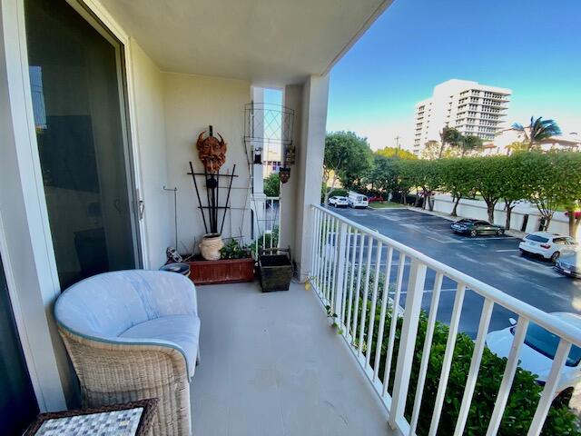 3594 South Ocean Boulevard, Unit 207 Highland Beach, FL 33487 - Photo 29 of 56 a view of a balcony with two chairs and a potted plant